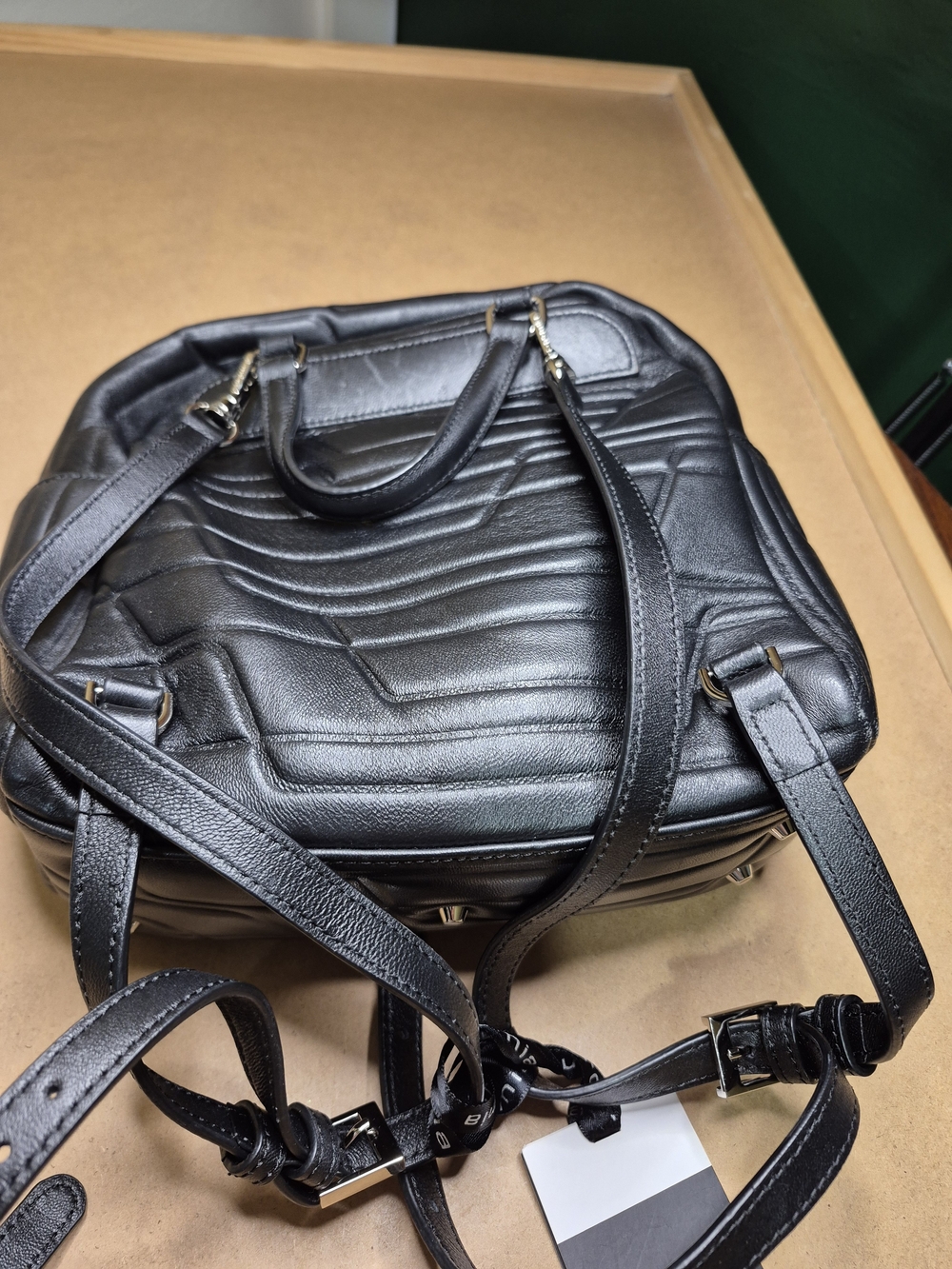 Black Quilted Leather Backpack with Polished Metal Clasp - Picture 4 of 11